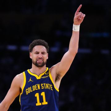 Apr 9, 2024; Los Angeles, California, USA; Golden State Warriors guard Klay Thompson (11) celebrates after a  three-point shot against the Los Angeles Lakers in the second half at Crypto.com Arena. Mandatory Credit: Kirby Lee-USA TODAY Sports