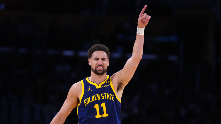 Apr 9, 2024; Los Angeles, California, USA; Golden State Warriors guard Klay Thompson (11) celebrates after a  three-point shot against the Los Angeles Lakers in the second half at Crypto.com Arena. Mandatory Credit: Kirby Lee-USA TODAY Sports