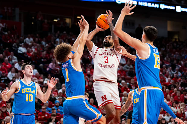 Nebraska Cornhuskers guard Brice Williams (3) shoots the ball against UCLA Bruins guard Trent Perry (1) and center Aday Mara 
