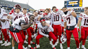 Texas Tech Red Raiders players celebrate after defeating the West Virginia Mountaineers. Mandatory Credit: Ben Queen-Imagn Images