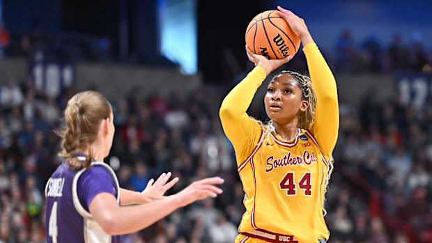 Kiki Iriafen shoots the ball