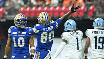 Nov 17, 2024; Vancouver, British Columbia, CAN; Winnipeg Blue Bombers wide receiver Ontaria Wilson (80) celebrates a play with wide receiver Nic Demski (10) against Toronto Argonauts during the second quarter at BC Place. Mandatory Credit: Simon Fearn-Imagn Images