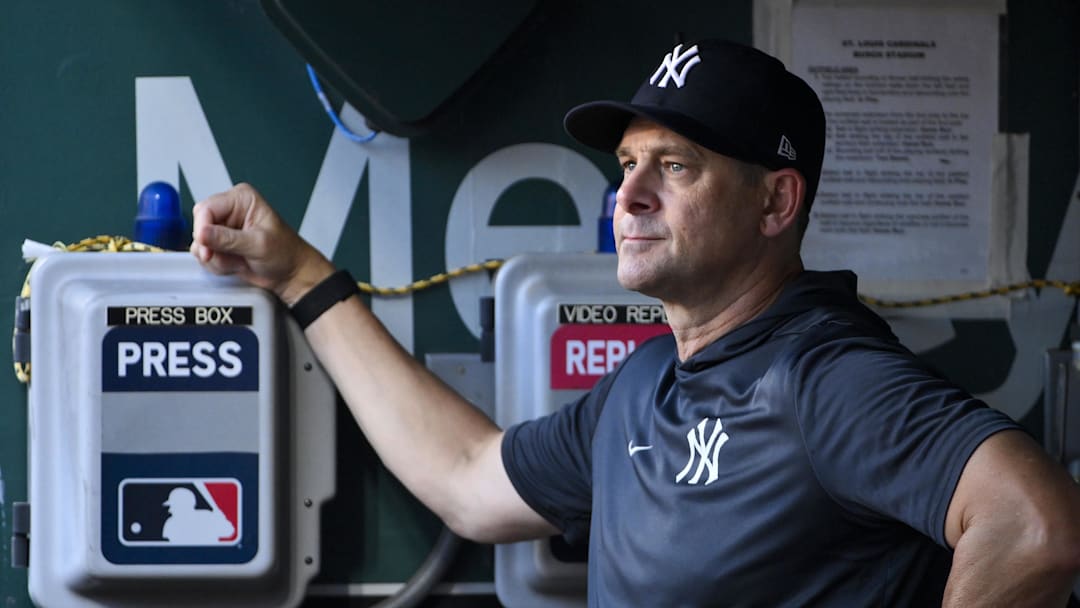 Aug 15, 2025; St. Louis, Missouri, USA;  New York Yankees manager Aaron Boone (17) looks on from the dugout before a game against the St. Louis Cardinals at Busch Stadium. Mandatory Credit: Jeff Curry-Imagn Images