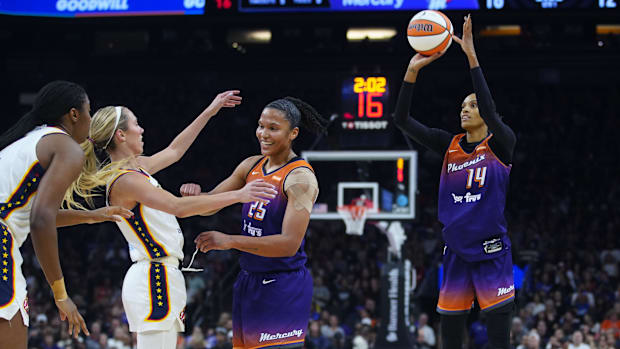 A photo of DeWanna Bonner hitting a three