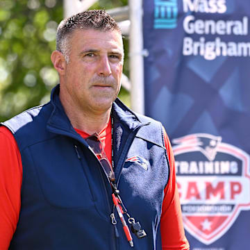 Jul 28, 2025; Foxborough, MA, USA; New England Patriots head coach Mike Vrabel heads to the practice fields for training camp at Gillette Stadium. Mandatory Credit: Eric Canha-Imagn Images