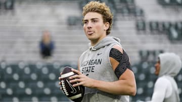 Nov 15, 2025; East Lansing, Michigan, USA; Michigan State quarterback Alessio Milivojevic (11) sticks his tongue out during warmups before a game against the Penn State Nittany Lions at Spartan Stadium. Mandatory Credit: Brendan Mullin-Imagn Images
