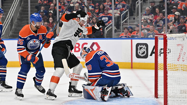 Jan 3, 2026; Edmonton, Alberta, CAN;  Edmonton Oilers defenseman Darnell Nurse (25) goes after Philadelphia Flyers right winger Garnet Hathaway (19) in front of Oilers goalie Calvin Pickard (30) during the second period at Rogers Place. Mandatory Credit: Walter Tychnowicz-Imagn Images