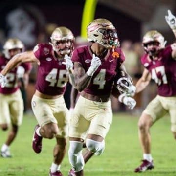 Seminoles wide receiver Keon Coleman sprints down the sideline in FSU's matchup with the Miami Hurricanes