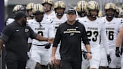 Purdue Boilermakers head coach Barry Odom takes the field with his team