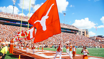 Aug 31, 2024; Austin, Texas, USA; Texas Longhorns cheerleaders waves the flag after a topdown during the first half of s gams at Darrell K Royal-Texas Memorial Stadium. Mandatory Credit: Aaron Meullion-Imagn Images