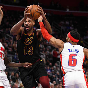 Jan 9, 2020; Detroit, Michigan, USA; Cleveland Cavaliers center Tristan Thompson (13) drives to the basket against Detroit Pistons forward Sekou Doumbouya (45) and guard Bruce Brown (6) during the fourth quarter at Little Caesars Arena. Mandatory Credit: Tim Fuller-Imagn Images