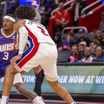 Oct 8, 2023; Detroit, Michigan, USA; Detroit Pistons guard Cade Cunningham (2) defends against Phoenix Suns guard Bradley Beal (3) during the first half of a pre-season game at Little Caesars Arena. Mandatory Credit: David Reginek-Imagn Images
