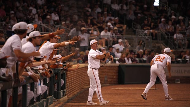 June 1, 2024; College Station, TX, USA; Texas Longhorns assistant coach Steve Rodriguez (7) and head coach David Pierce (22) alert umpires of a clock violation by a Texas A&M Aggies batter during the second round in the NCAA baseball College Station Regional at Olsen Field College Station. Mandatory Credit: Dustin Safranek-USA TODAY Sports
