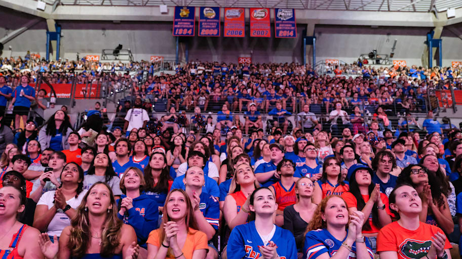 Fans watch the NCAA national championship men's basketball game between the Florida Gators and the Houston Cougars