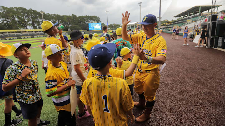 Savannah Bananas coach Tyler Gillum greets players during the opening ceremony for the Banana Ball Youth Tournament on Wednesday, July 9, 2025 at Historic Grayson Stadium in Savannah. Savannah Bananas coach Tyler Gillum greets players during the opening ceremony for the Banana Ball Youth Tournament on Wednesday, July 9, 2025 at Historic Grayson Stadium in Savannah.