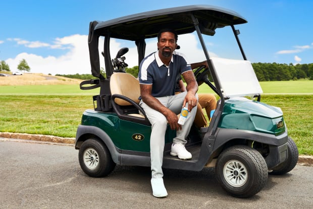 J.R. Smith sits on a golf cart.