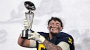 Jan 1, 2024; Pasadena, CA, USA; Michigan Wolverines defensive lineman Mason Graham (55) celebrates with the Leishman Trophy after defeating the Alabama Crimson Tide in the 2024 Rose Bowl college football playoff semifinal game at Rose Bowl. Mandatory Credit: Jayne Kamin-Oncea-Imagn Images