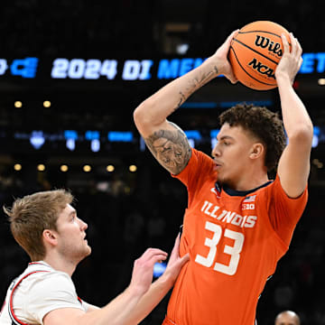 Mar 30, 2024; Boston, MA, USA; Illinois Fighting Illini forward Coleman Hawkins (33) attempts to dribble against the Connecticut Huskies in the finals of the East Regional of the 2024 NCAA Tournament at TD Garden. Mandatory Credit: Brian Fluharty-Imagn Images