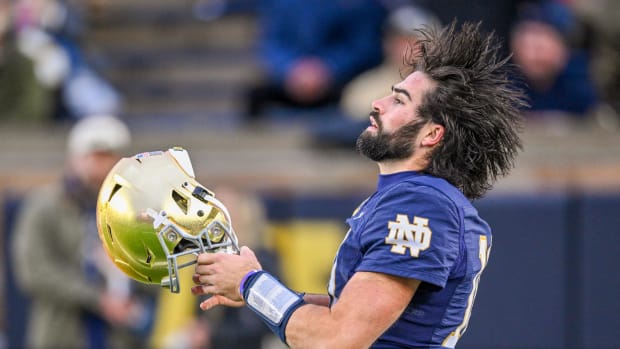 Sam Hartman puts his helmet on before the Notre Dame vs. USC game in 2023