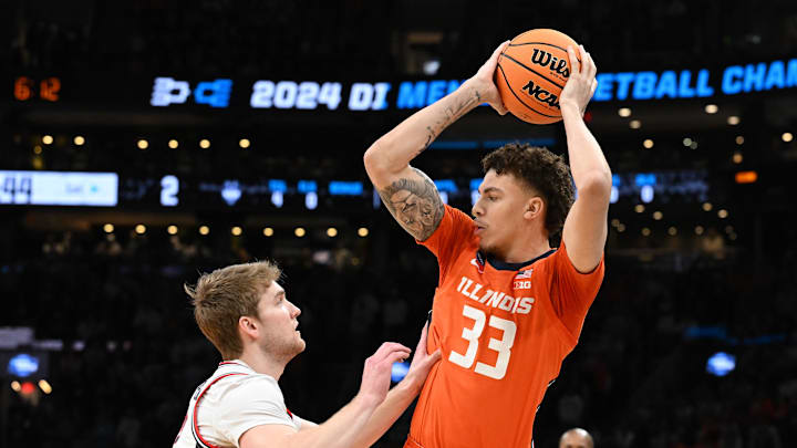 Mar 30, 2024; Boston, MA, USA; Illinois Fighting Illini forward Coleman Hawkins (33) attempts to dribble against the Connecticut Huskies in the finals of the East Regional of the 2024 NCAA Tournament at TD Garden. Mandatory Credit: Brian Fluharty-Imagn Images