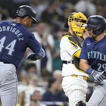 Jun 9, 2024; San Diego, California, USA; Seattle Mariners catcher Cal Raleigh (29) is congratulated by Julio Rodriguez (44) after hitting a two-run home run during the seventh inning against the San Diego Padres at Petco Park. Mandatory Credit: Denis Poroy-USA TODAY Sports at Petco Park. 