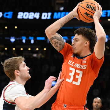Mar 30, 2024; Boston, MA, USA; Illinois Fighting Illini forward Coleman Hawkins (33) attempts to dribble against the Connecticut Huskies in the finals of the East Regional of the 2024 NCAA Tournament at TD Garden. Mandatory Credit: Brian Fluharty-USA TODAY Sports