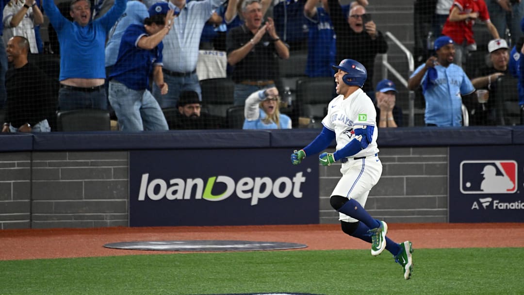 Oct 20, 2025; Toronto, Ontario, CAN; Toronto Blue Jays right fielder George Springer (4) celebrates as he runs the bases after hitting a three run home run against the Seattle Mariners in the seventh inning during game seven of the ALCS round for the 2025 MLB playoffs at Rogers Centre. Mandatory Credit: Dan Hamilton-Imagn Images