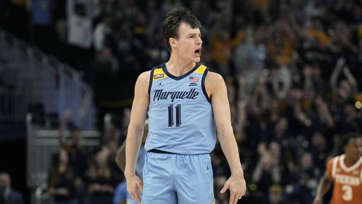 Dec 6, 2023; Milwaukee, Wisconsin, USA;  Marquette Golden Eagles guard Tyler Kolek (11) reacts after scoring a basket during the first half against the Texas Longhorns at Fiserv Forum. Mandatory Credit: Jeff Hanisch-USA TODAY Sports