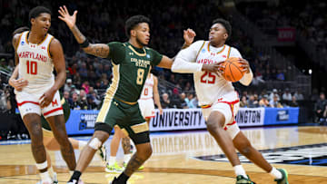 Mar 23, 2025; Seattle, WA, USA; Maryland Terrapins center Derik Queen (25) drives to the basket against Colorado State Rams forward Jaylen Crocker-Johnson (8) in the first half at Climate Pledge Arena. Mandatory Credit: Steven Bisig-Imagn Images