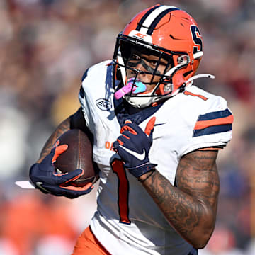Nov 9, 2024; Chestnut Hill, Massachusetts, USA; Syracuse Orange running back LeQuint Allen (1) runs for a touchdown against the Boston College Eagles during the first half at Alumni Stadium. 