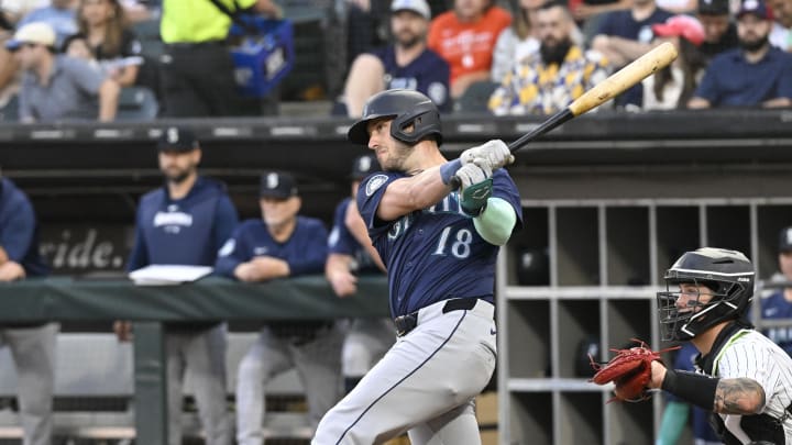 Jul 26, 2024; Chicago, Illinois, USA;  Seattle Mariners designated hitter Mitch Garver (18) hits an RBI double against the Chicago White Sox during the first inning at Guaranteed Rate Field. Mandatory Credit: Matt Marton-USA TODAY Sports