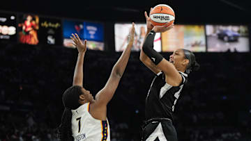 Sep 21, 2025; Las Vegas, Nevada, USA; Las Vegas Aces center A'ja Wilson (22) shoots the ball against Indiana Fever center Aliyah Boston (7) during the third quarter in game one of the second round for the 2025 WNBA Playoffs at Michelob Ultra Arena. Mandatory Credit: Lucas Peltier-Imagn Images