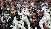 Dec 7, 2025; Cleveland, Ohio, USA; Cleveland Browns defensive end Myles Garrett (95) sacks Tennessee Titans quarterback Cam Ward (1) during the second quarter at Huntington Bank Field. Mandatory Credit: Ken Blaze-Imagn Images