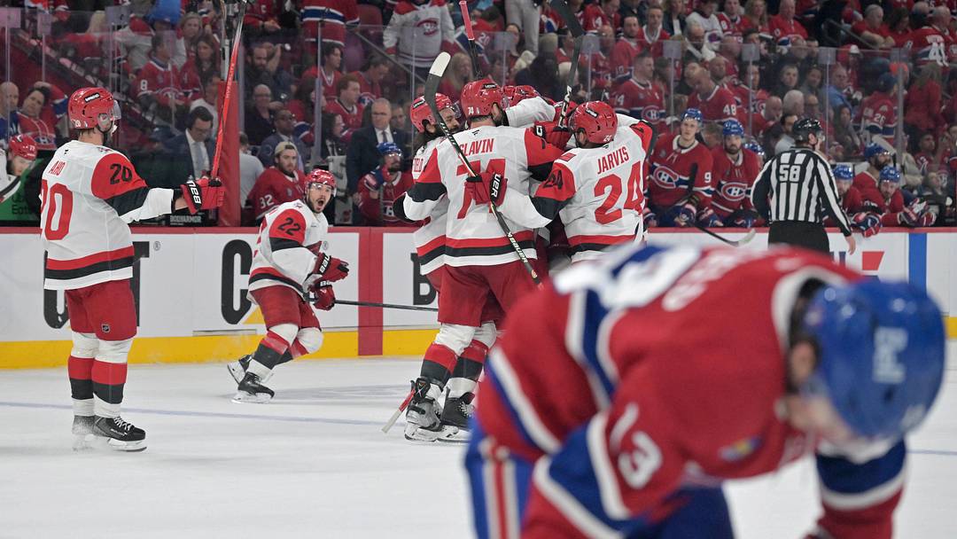 May 25, 2026; Montreal, Quebec, CAN; Carolina Hurricanes players celebrate after winning game three of the Eastern Conference Final against the Montreal Canadiens of the 2026 Stanley Cup Playoffs at Bell Centre. Mandatory Credit: Eric Bolte-Imagn Images
