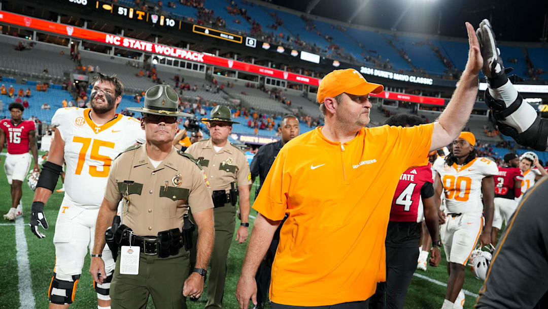 Tennessee head coach Josh Heupel slaps hands with Tennessee offensive lineman Lance Heard (53) after the win over NC State in the Duke's Mayo Classic NCAA College football game on Saturday, Sept. 7, 2024 in Charlotte, NC.