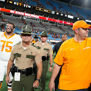 Tennessee head coach Josh Heupel slaps hands with Tennessee offensive lineman Lance Heard (53) after the win over NC State in the Duke's Mayo Classic NCAA College football game on Saturday, Sept. 7, 2024 in Charlotte, NC.