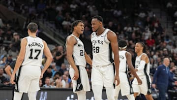 Nov 9, 2022; San Antonio, Texas, USA;  San Antonio Spurs guard Devin Vassell (24) celebrates a play by San Antonio Spurs center Charles Bassey (28) in the first half against the Memphis Grizzlies at the AT&T Center. Mandatory Credit: Daniel Dunn-Imagn Images