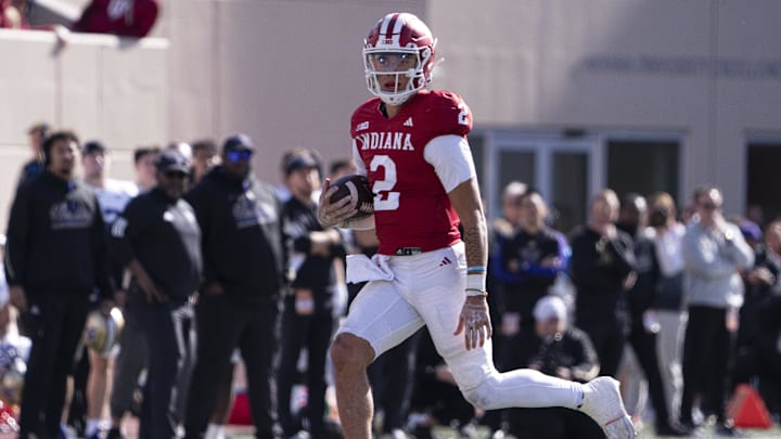 Oct 26, 2024; Bloomington, Indiana, USA; Indiana Hoosiers quarterback Tayven Jackson (2) runs the ball during the fourth quarter against the Washington Huskies at Memorial Stadium. Mandatory Credit: Jacob Musselman-Imagn Images