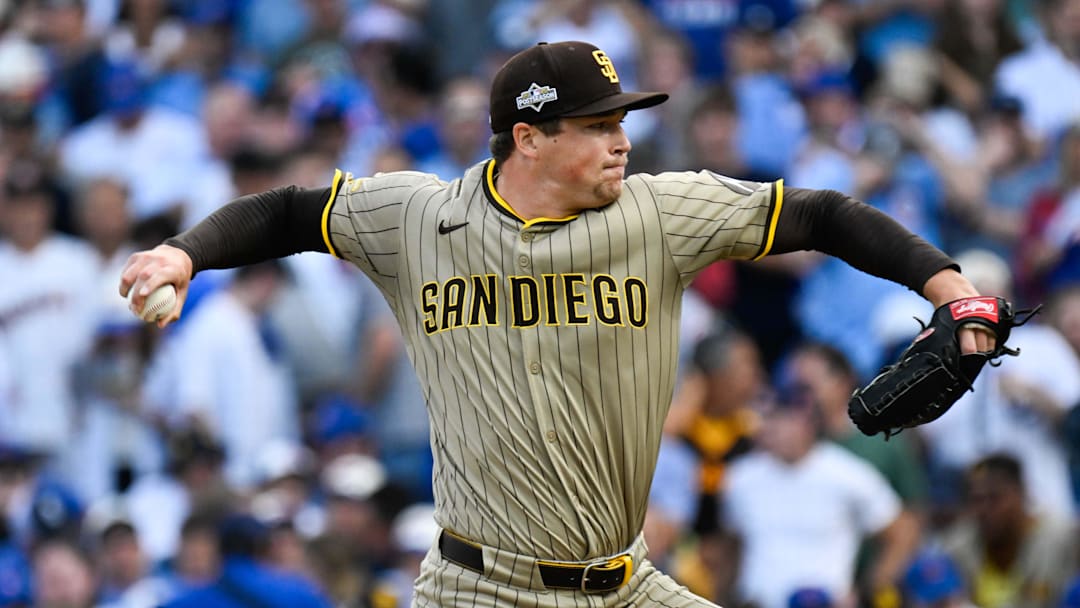 San Diego Padres pitcher Mason Miller (22) delivers during the seventh inning against the Chicago Cubs during game two of the Wildcard round for the 2025 MLB playoffs at Wrigley Field. 