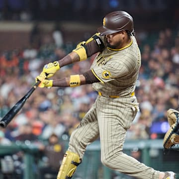 Sep 14, 2024; San Francisco, California, USA; San Diego Padres infielder Luis Arraez (4) hits an RBI single against the San Francisco Giants during the sixth inning at Oracle Park.