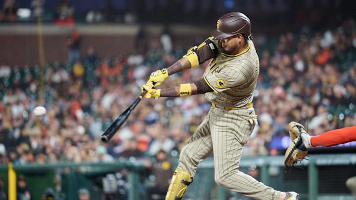 Sep 14, 2024; San Francisco, California, USA; San Diego Padres infielder Luis Arraez (4) hits an RBI single against the San Francisco Giants during the sixth inning at Oracle Park.