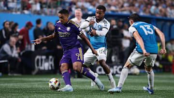 Nov 1, 2024; Charlotte, North Carolina, USA;  Orlando City forward Luis Muriel (9) controls the ball against Charlotte FC defender Nathan Byrne (14) during the second half at Bank of America Stadium. Mandatory Credit: Scott Kinser-Imagn Images
