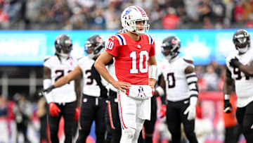 Oct 13, 2024; Foxborough, Massachusetts, USA; New England Patriots quarterback Drake Maye (10) reacts after a sack  during the first half of a game against the Houston Texans at Gillette Stadium. Mandatory Credit: Brian Fluharty-Imagn Images