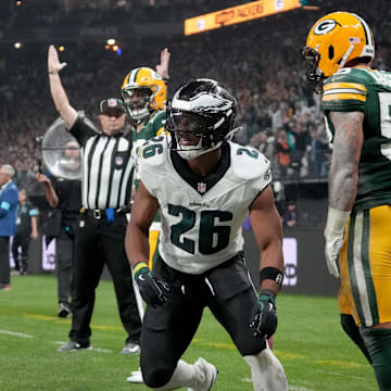 Sep 6, 2024; Sao Paulo, BRA; Philadelphia Eagles running back Saquon Barkley (26) celebrates after a touchdown against Green Bay Packers linebacker Isaiah McDuffie (58) during the second quarter at Neo Quimica Arena. Kirby Lee-Imagn Images