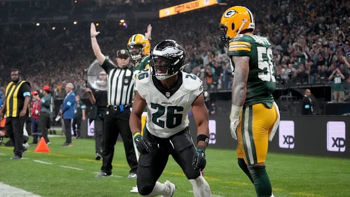 Sep 6, 2024; Sao Paulo, BRA; Philadelphia Eagles running back Saquon Barkley (26) celebrates after a touchdown against Green Bay Packers linebacker Isaiah McDuffie (58) during the second quarter at Neo Quimica Arena. Kirby Lee-Imagn Images