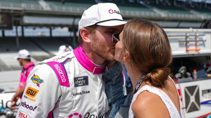 NASCAR Xfinity Series driver Conor Daly (26) kisses his girlfriend Amy Marie Gaertner during qualifying for the Pennzoil 250, Saturday, July 20, 2024, at Indianapolis Motor Speedway.