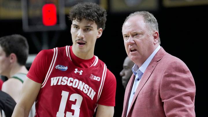 Wisconsin head coach Greg Gard talks with guard Hayden Jones (13) during the second half of their preseason game Thursday, Oct. 15, 2026 at the Resch Center in Green Bay, Wisconsin. Wisconsin beat UW-Green Bay 96-77.