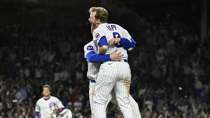 Chicago Cubs outfielder Ian Happ celebrates hitting a walk off single with teammate Pete Crow-Armstrong.
