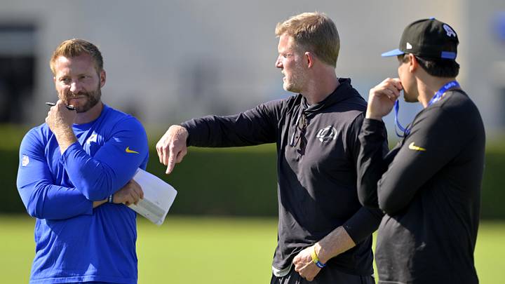 Jul 29, 2024; Los Angeles, CA, USA; Los Angeles Rams head coach Sean McVay, general manager Les Snead, and chief of staff Carter Crutchfield talk on the field during training camp at Loyola Marymount University. Mandatory Credit: Jayne Kamin-Oncea-Imagn Images