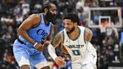 Mar 16, 2025; Inglewood, California, USA; Charlotte Hornets forward Miles Bridges (0) moves the ball against LA Clippers guard James Harden (1) during the first half at Intuit Dome. Mandatory Credit: Jonathan Hui-Imagn Images